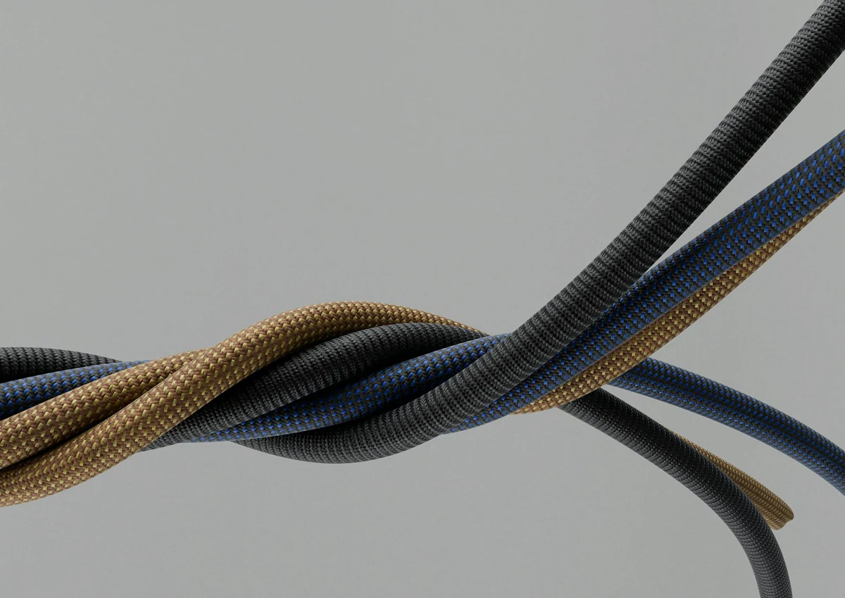 A close-up of a 3D model featuring twisted electronic cables
