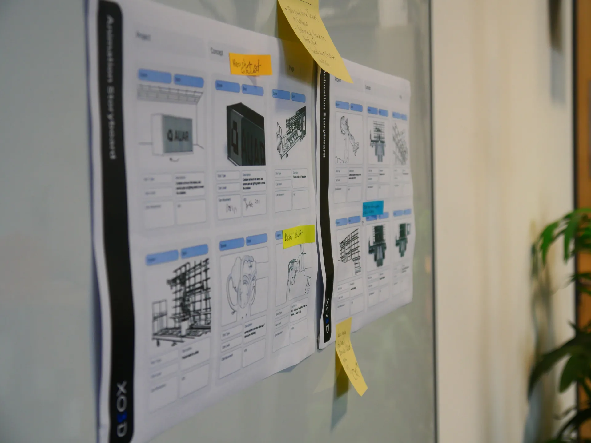 AUAR MicroFactory animation storyboard mounted on the studio wall for pre-production shot planning