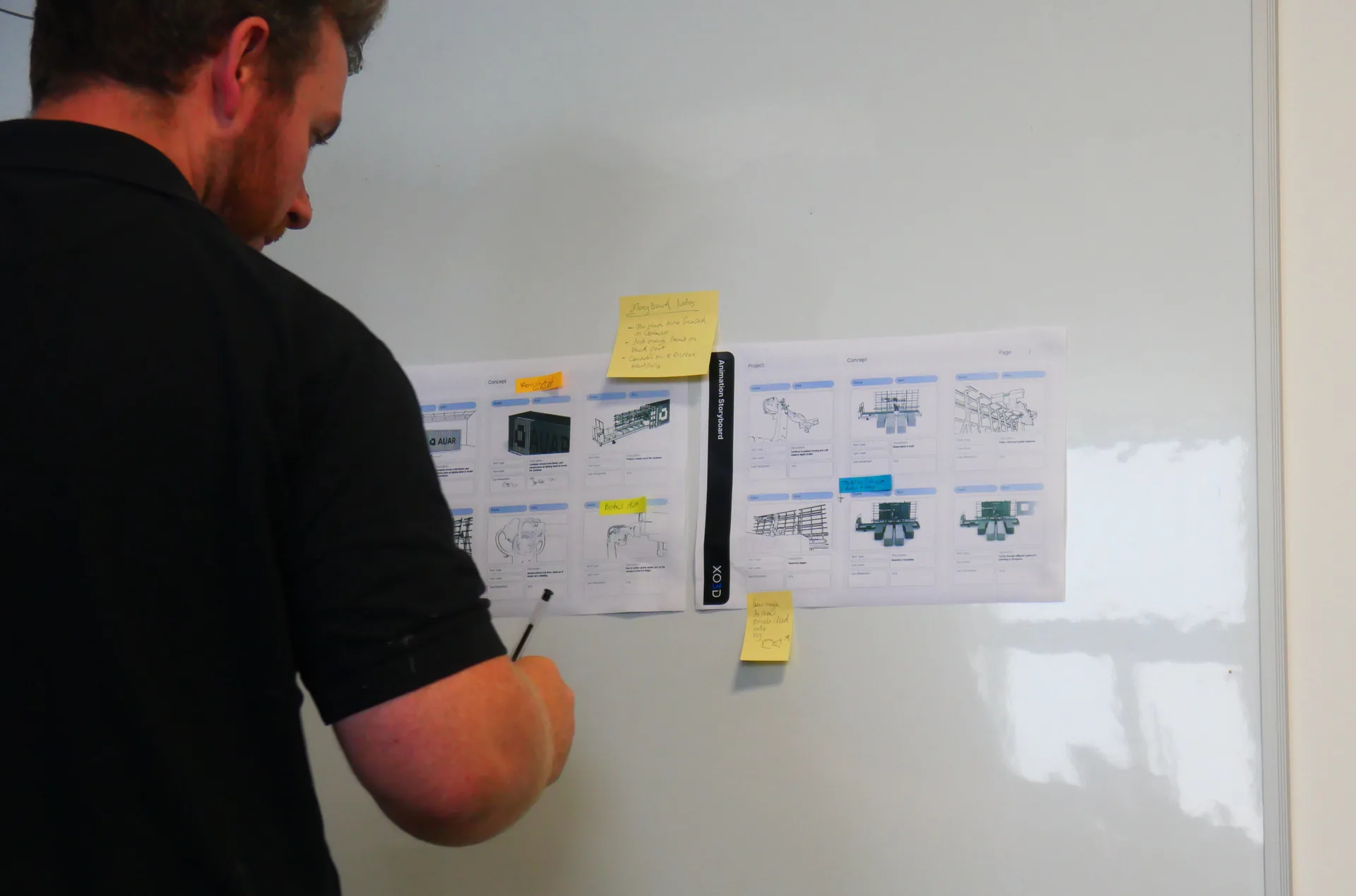 Close-up of the AUAR MicroFactory animation storyboard printout, with hero and detail shots annotated