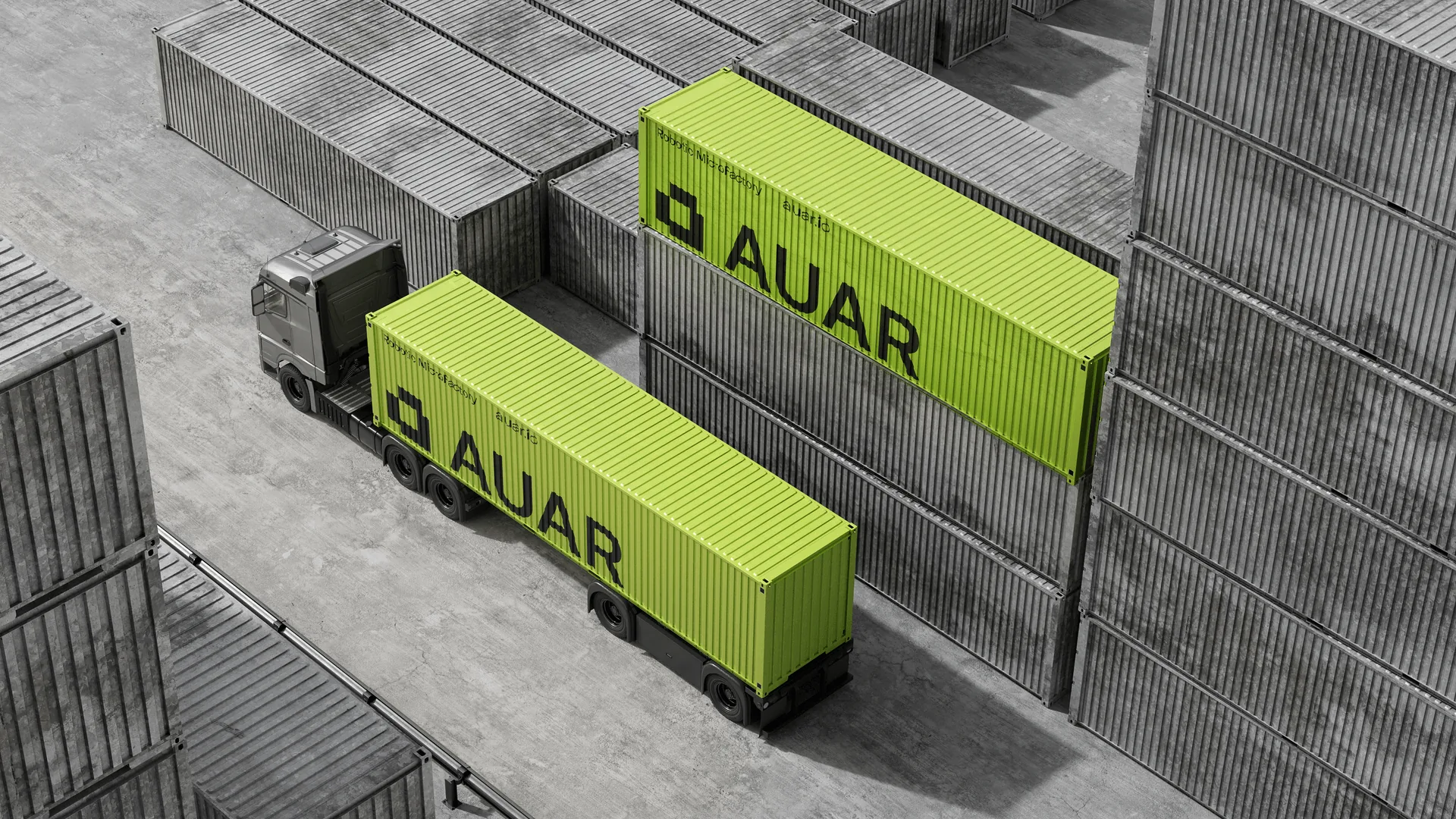 Two green AUAR MicroFactory containers in an industrial storage yard