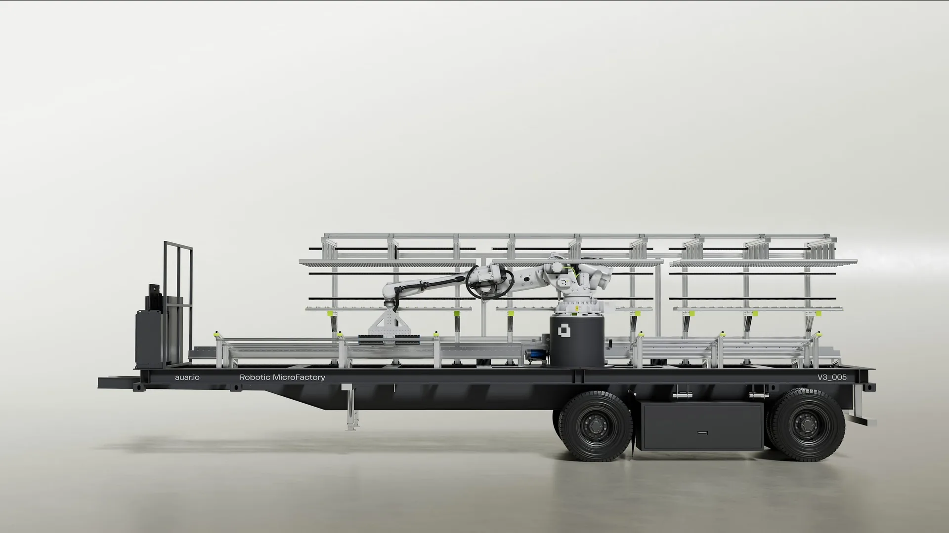 Side view of the AUAR MicroFactory mounted on a long transport trailer