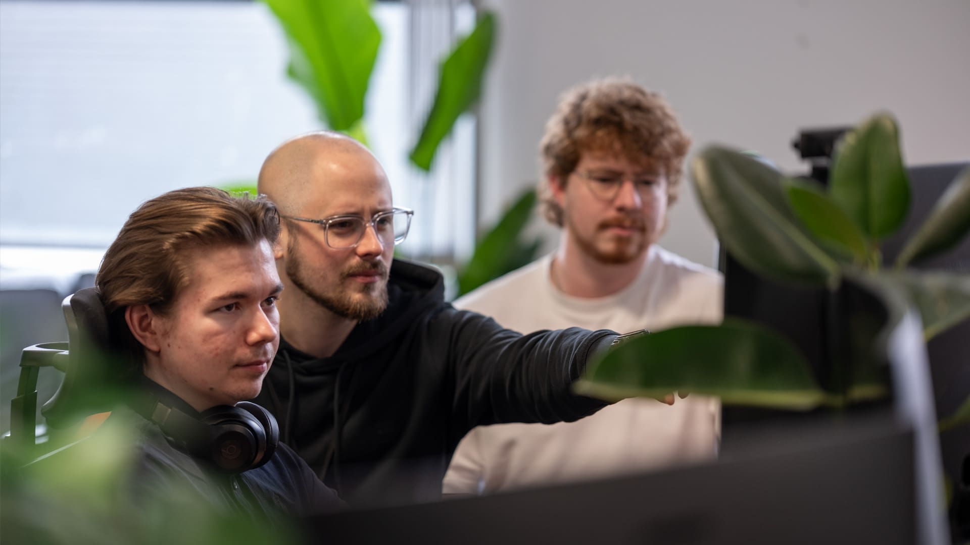 XO3D artists reviewing product CGI at a workstation