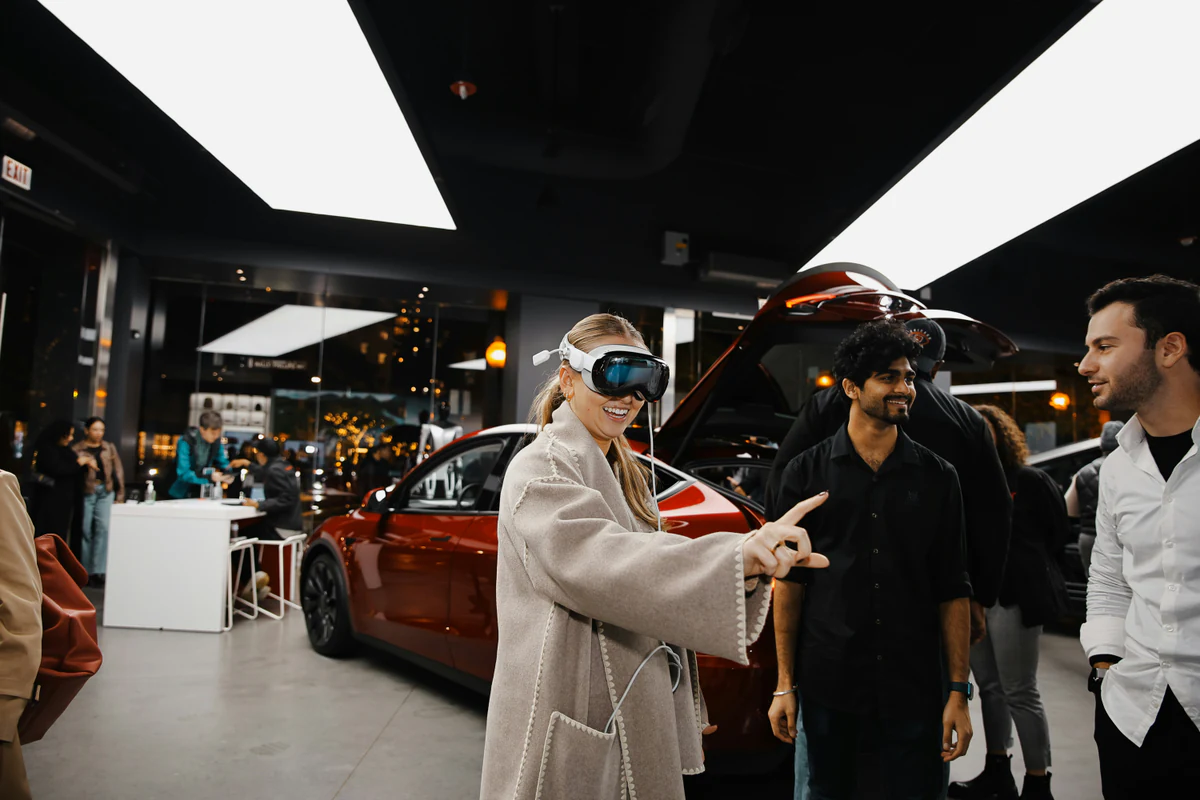 Shoppers trying a VR headset in a car showroom