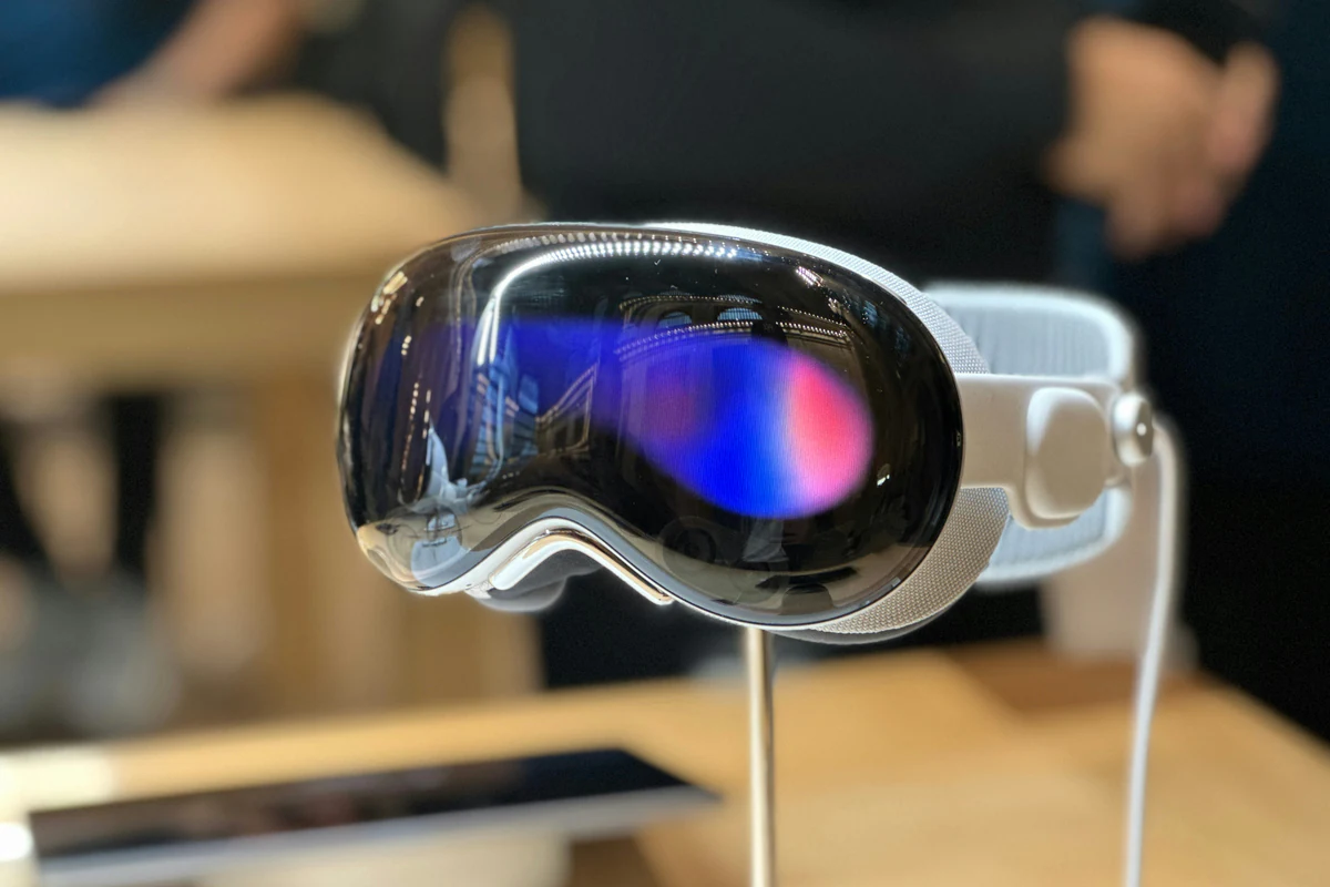 Apple Vision Pro headset on a store display stand