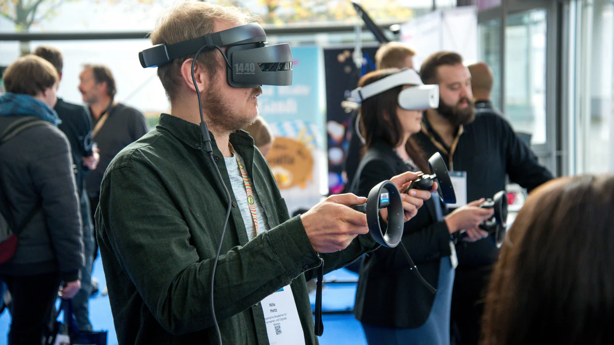Visitors trying VR headsets at a technology expo