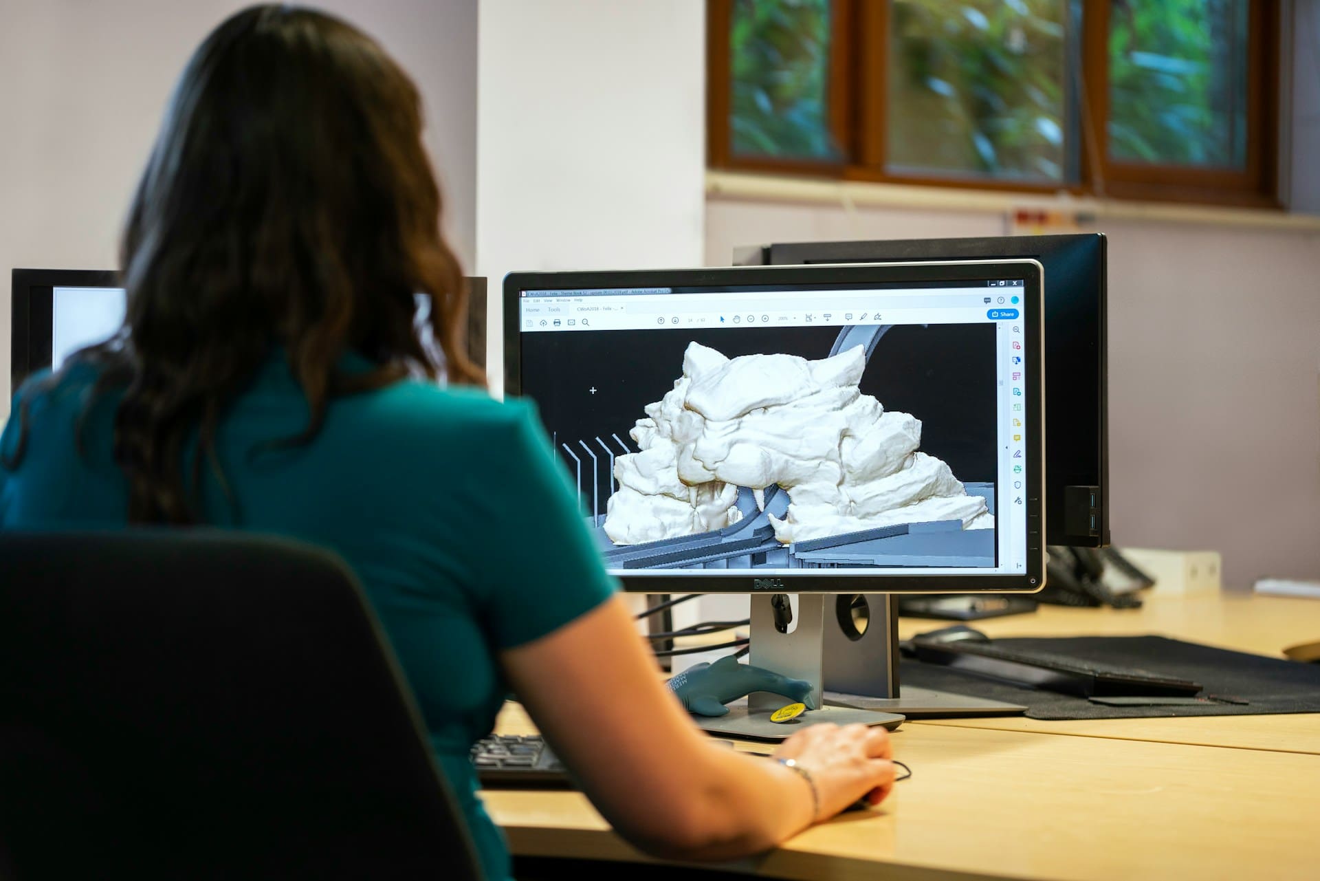 A female developer using ai-assisted 3D modelling in her workflow